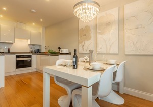 A two-bedroom modern and sleek apartment with sea views and an outdoor terrace.