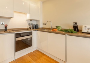 A two-bedroom modern and sleek apartment with sea views and an outdoor terrace.