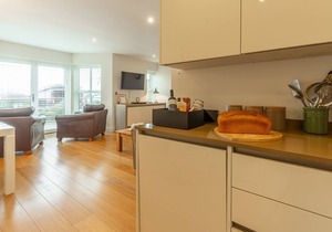 A two-bedroom modern and sleek apartment with sea views and an outdoor terrace.