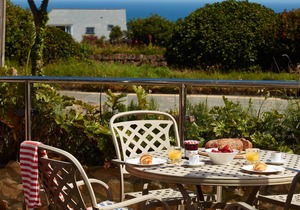 A two-bedroom modern and sleek apartment with sea views and an outdoor terrace.