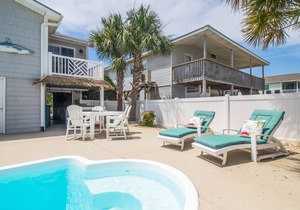 Absolutely Charming Coastal Cottage! Prime Location on the Island!