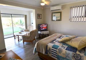 Apartment in large tropical garden with pool and sea view