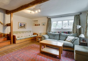 Badgers Cottage is a lovely period thatched cottage with garden and parking, situated in the picture