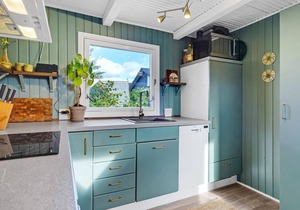 Beautiful cottage in the greenery with sea view, located in a small cottage area.