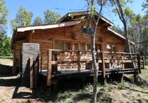 Cabaa rstica 2 maravillosa,con troncos nativos, con orilla de Ro Trancura