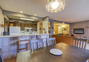 Charming condo with a hot tub, sauna, balcony, deck, game room, & gas fireplace