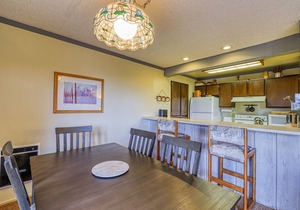 Charming condo with a hot tub, sauna, balcony, deck, game room, & gas fireplace