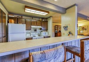 Charming condo with a hot tub, sauna, balcony, deck, game room, & gas fireplace