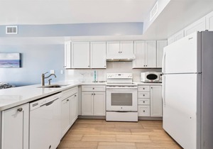 COME AND ENJOY this beautifully decorated beachfront townhome where you can soak up the sun!