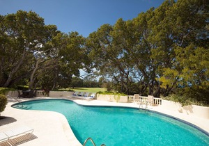 Commanding views of the verdant fairway and the Caribbean Sea beyond, is Casuarina House