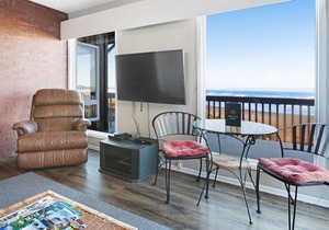 Dog-friendly, oceanfront condo w/ beach access, cozy fireplace, and large deck