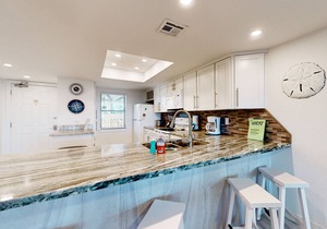 Fully Renovated Getaway with Beachfront Patio - Steps to Pool & Hot Tub