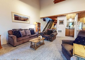 Homey Condo, Right Across from The Village! Forested Setting & Balcony