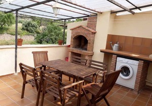 House Ana III. Attic terrace and fireplace