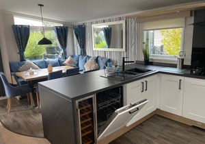 Indulgence Lakeside Lodge i3 is prime location with a private fishing peg and sunken hot tub