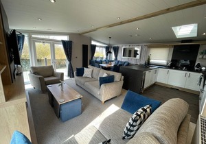 Indulgence Lakeside Lodge i3 is prime location with a private fishing peg and sunken hot tub