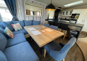 Indulgence Lakeside Lodge i3 is prime location with a private fishing peg and sunken hot tub