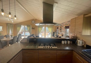 luxury lakeside lodge with a sunken hot tub on bull rush a peaceful feature lake @Tattershall lakes