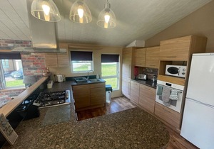 luxury lakeside lodge with a sunken hot tub on bull rush a peaceful feature lake @Tattershall lakes