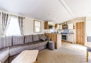 Modern and contemporary 12ft-wide caravan with one double and one twin.