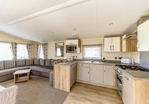 Modern and contemporary 12ft-wide caravan with one double and one twin.