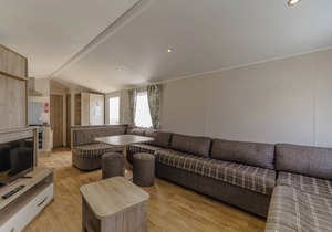 Modern and contemporary 12ft-wide caravan with one double and two twin.