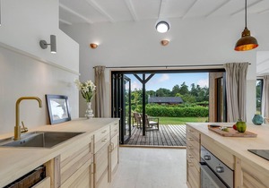 Modern, stylish cottage with bio fireplace, natural plot and views of fields.