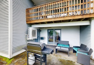 Newly-furnished condo with loft, fast WiFi, partial AC, grills & yard access