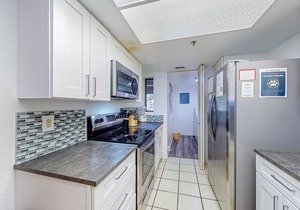 Ski-in/out condo with mountain view, private hot tub, deck & fireplace