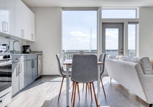 Stunning Logan Square 2BR w/Roof Deck & Gym, 1 block to L, by Blueground