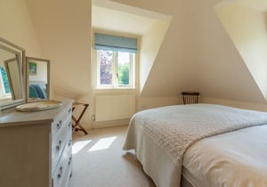 This much-loved detached family holiday home is set in glorious secluded gardens