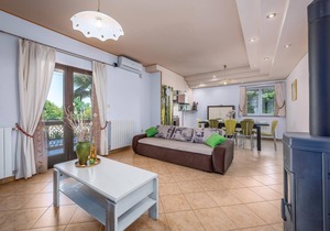 This vacation home with pool has a spacious outdoor area and konoba (social room).