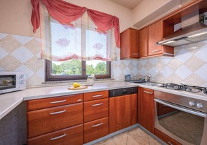 This vacation home with pool has a spacious outdoor area and konoba (social room).