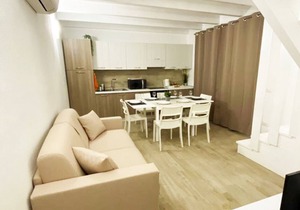 Two-story three-room apartment within walking distance of the sea, in a serviced area, with two balconies