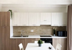 Two-story three-room apartment within walking distance of the sea, in a serviced area, with two balconies