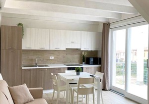 Two-story three-room apartment within walking distance of the sea, in a serviced area, with two balconies