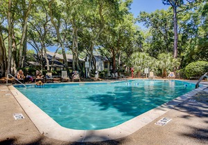 Updated condo with patio, shared pool, and WiFi - walk to Folly Field Beach Park