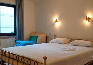 Welcome to this comfortable vacation apartment near the beach with side sea view.