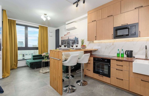 Mirow Apartment | 15th Floor Apartment in Warsaw Center