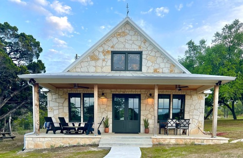 Johnson City House | 2 bedroom/2 bath stone farmhouse overlooking hill country creek on 50 acres