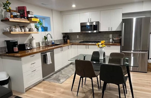 Glenmore House | 3 bdrm suite w/rooftop patio, firetable & sauna + hot tub, cold plunge & more!