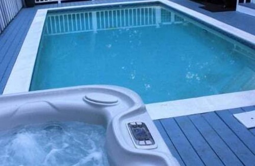 North Forest Beach House | 3 Quail St Retreat, 4th Row, Less than 100 strides to Beach, with Pool & Hot Tub, Dogs OK