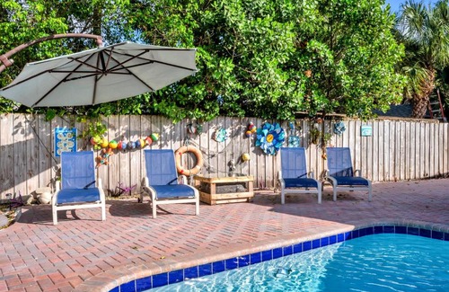 Garden Isles House | 4 bd Near beach spacious solar heated pool waterfront home