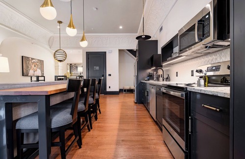 Central Business District Hotel | 4BR 2-Story Historic Space Steps from French Quarter | The Mayfair