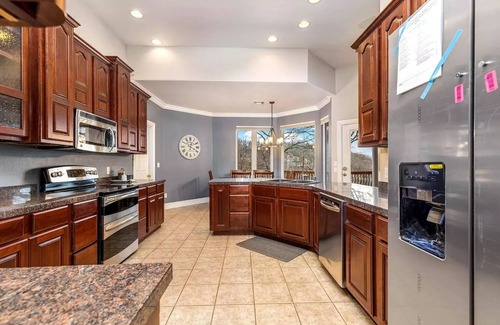 Grove House | 5-Bedrooms on the water! 2 Kitchens, Hot Tub, and Theatre!
