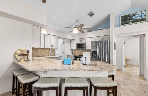 Mid Island House | 5550 Palmetto Paradise: 3BR w/ Gulf Views, Heated Pool