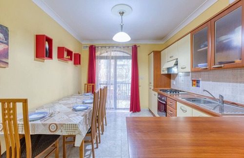 Bugibba Apartment | A colourful 3BR home, with Smart TV & Balcony