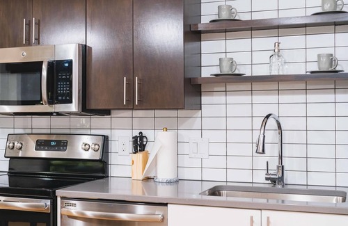 Downtown Omaha Apartment | A historic beautifully detailed suite, 1,300 square foot, corner loft in the heart of the Old Market