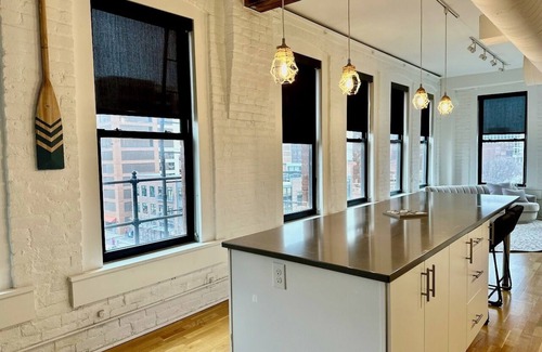 Downtown Omaha Apartment | A historic beautifully detailed suite, 1,300 square foot, corner loft in the heart of the Old Market