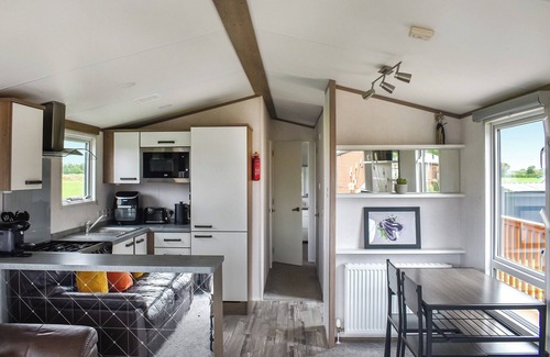 Stonham Aspal Cottage | A lovely bright lodge next to a field on a great site for people of all ages.